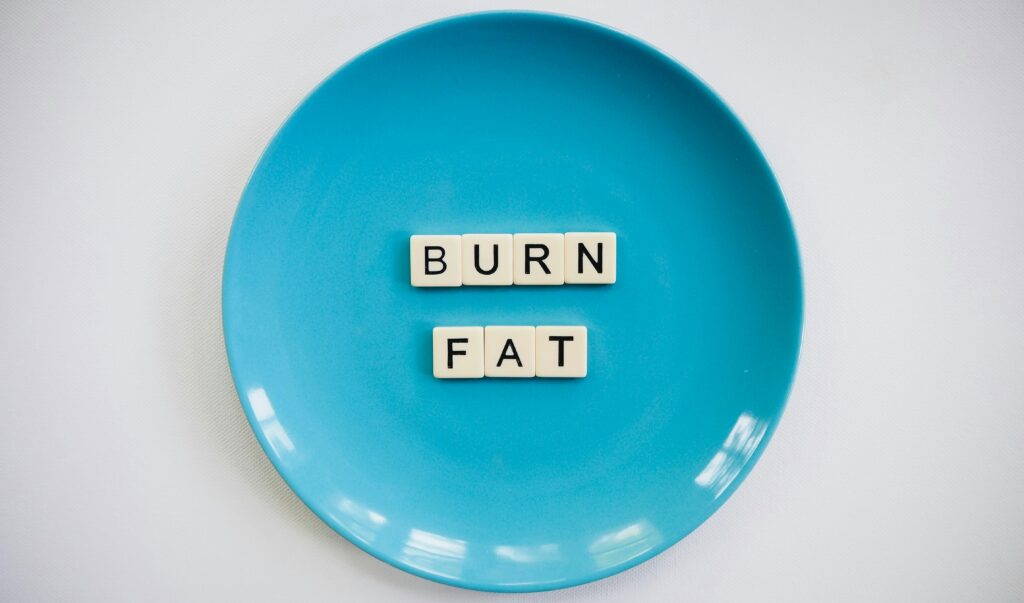 blue plate with scrabble letters that read burn fat