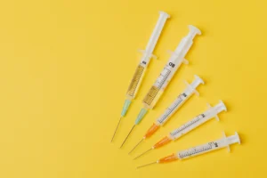 needles of various sizes displayed against a yellow background
