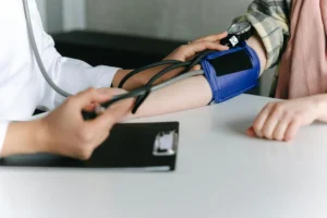 close up of a medical professional measuring blood pressure