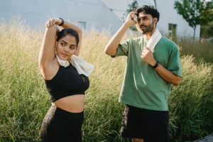 man and woman taking a break from physical activity