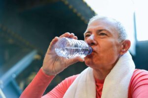 Photo of man drinking water